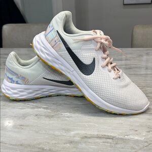 Women’s Nike Revolution size 9 tennis shoes multicolor white